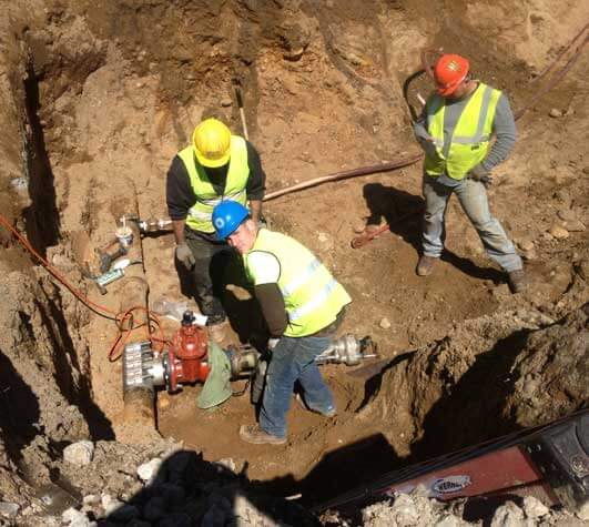 Plumber fixing clogged drain quickly and efficiently